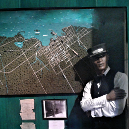A porter in uniform overlooking Collingwood's railway and harbour system