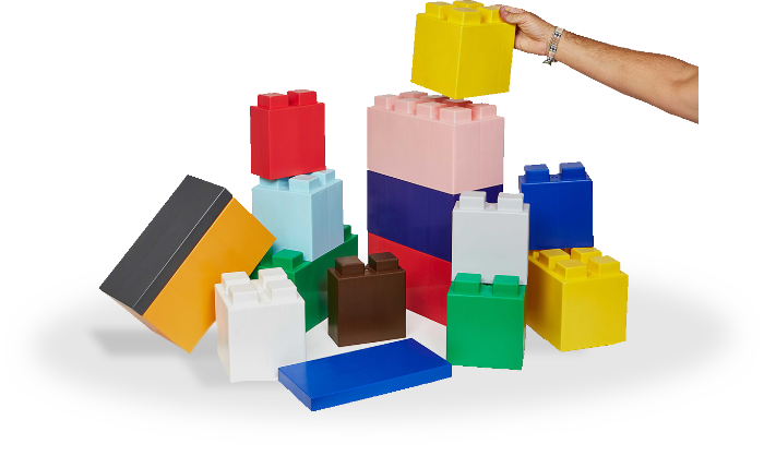 photo of giant multicoloured lego blocks being stacked