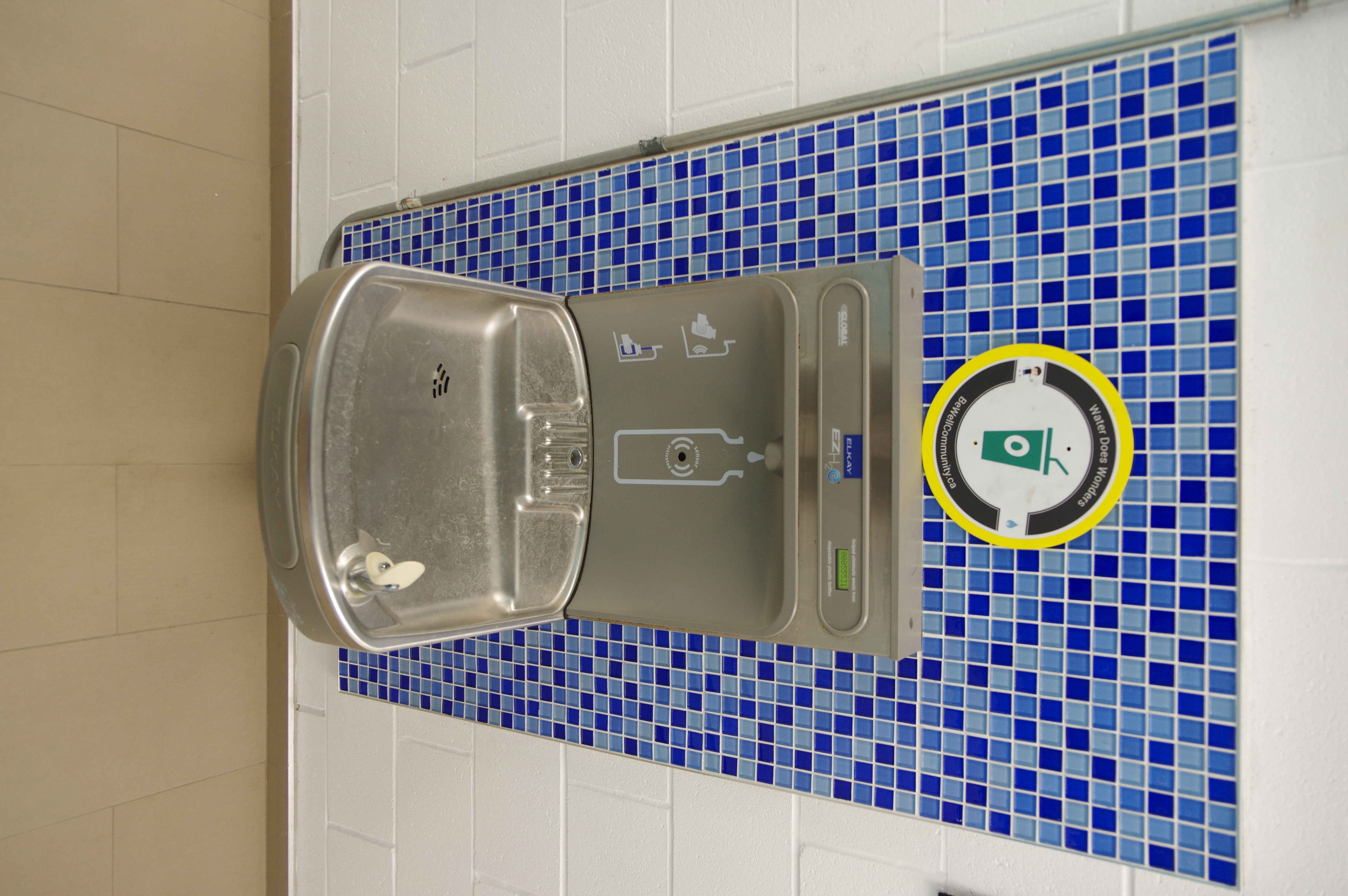 Located along the hallway towards the change rooms and washrooms on the south side of the building.