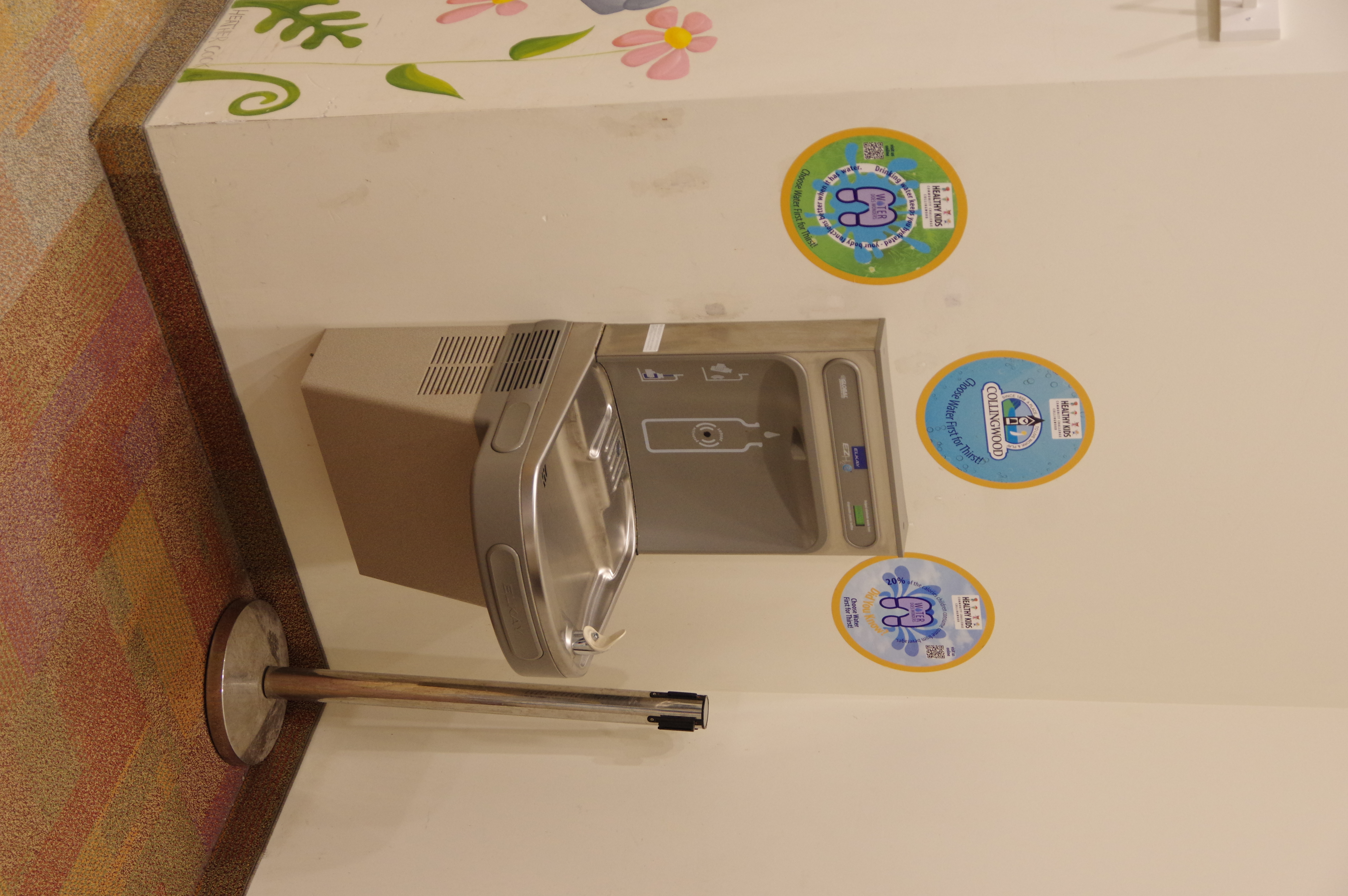 just before the public washrooms is the water refill station