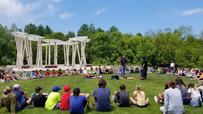 Photo for people listening to Elder speak at the Awen Gathering Place