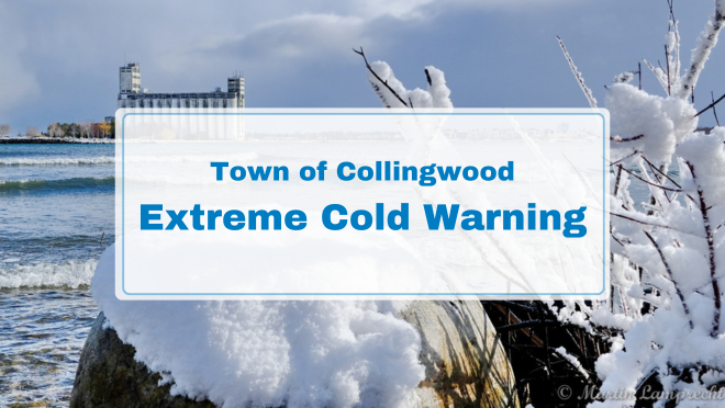 snow covered rocks in foreground, snowy terminals in background