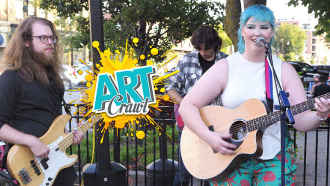 A band plays music outdoors.