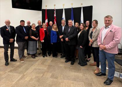 Group photo of Collingwood Council, New Tecumseth Council and MPP Saunderson