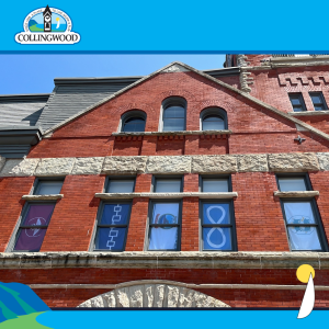 National Indigenous Peoples Day photo of the exterior of a building with 4 flags hung in its windows