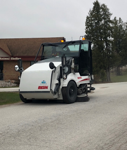photo of street sweeper on pavement