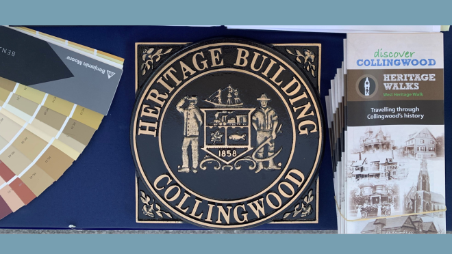 heritage building plaque with colour palette and brochures on a table