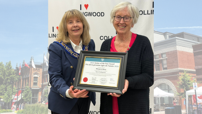 Mayor Hamlin and Margaret Mooy holding award certificate