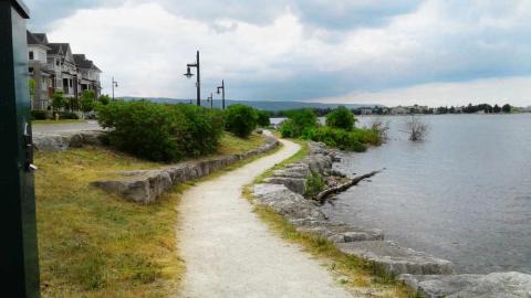 This is a picture of a granular trail alongside the waterfront at the promenade.