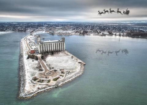 aerial of grain terminals with a sleigh and reindeer flying over