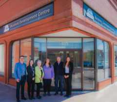 A group of people standing in front of the Business Development Centre in Collingwood