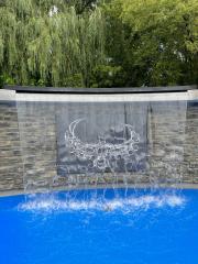 Waterfall flowing into a blue pool