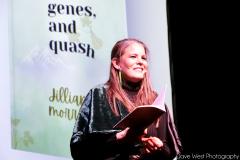 Poet Laureate Jillian Morris on stage reading