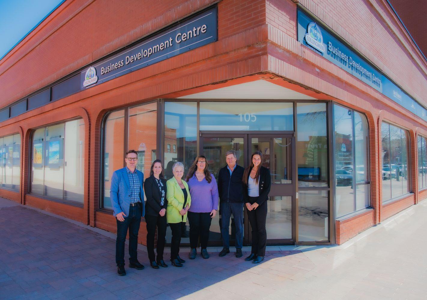 Employees standing outside of the Business Development Centre.