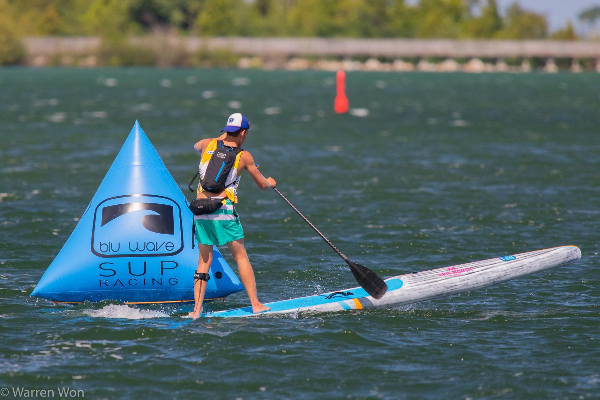 SUP boarder going around a buoy