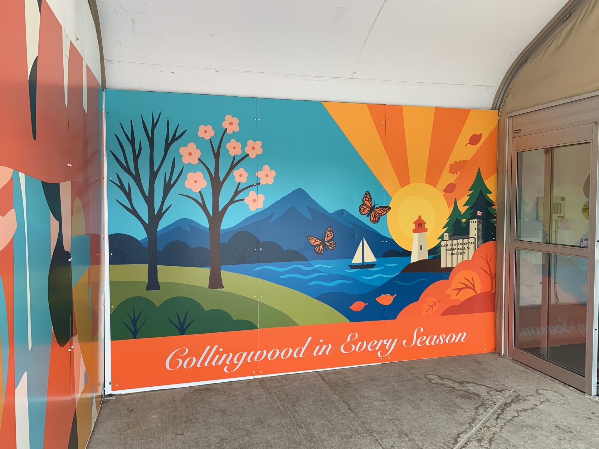 landscape mural with trees, water, a mountain, sun and grass