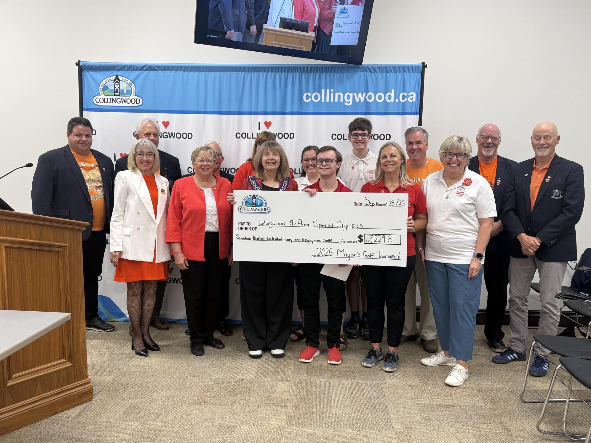 Group of people with a giant cheque